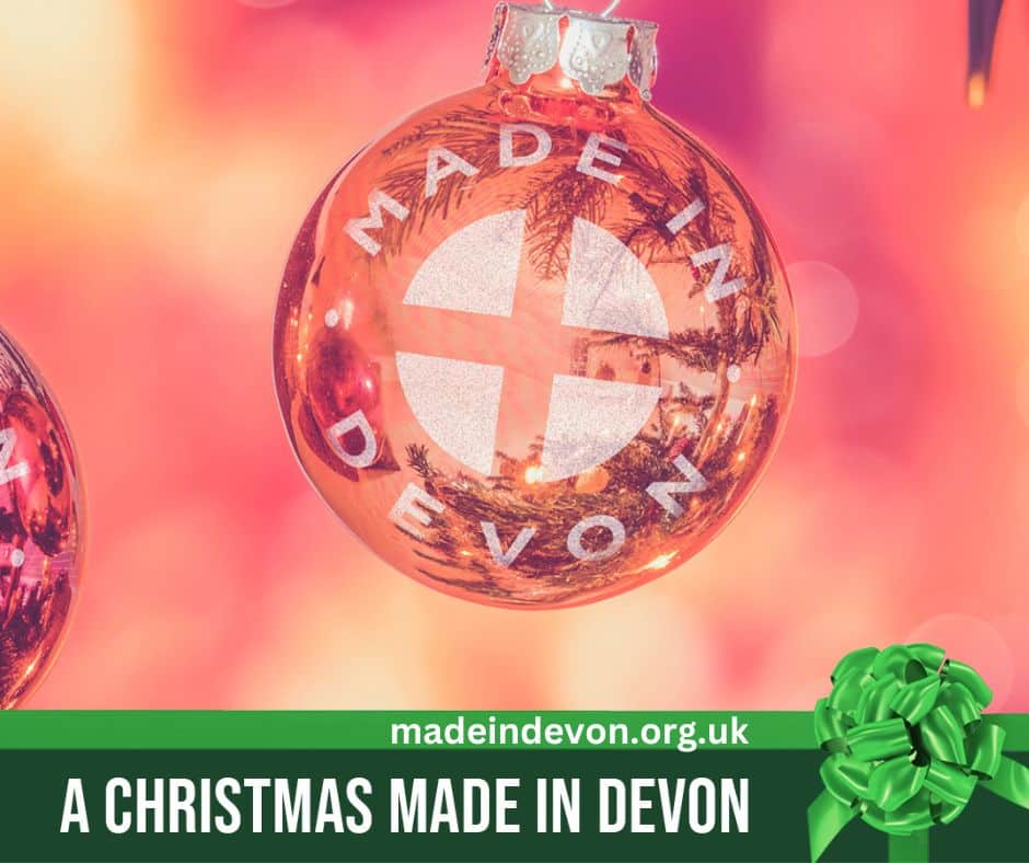 Red bauble featuring the Made in Devon logo. Text reads 'CHRISTMAS MADE IN DEVON.'