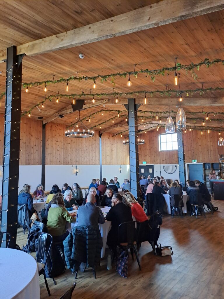 People engaged in discussions at the strategy launch